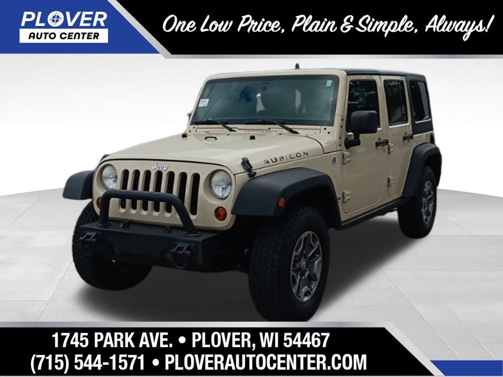 2011 Jeep Wrangler Rubicon in Sahara Tan Clearcoat — front three-quarter view